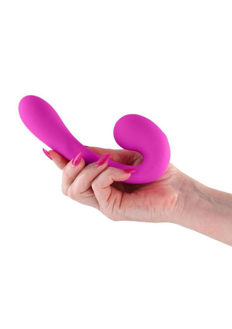 Gold-n-Dreams Maria Rechargeable Silicone Vibrator Fuchsia held in hand showcasing its flexible design.