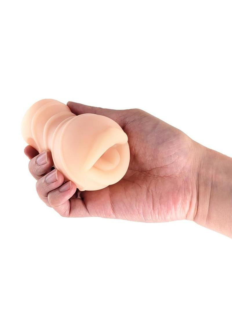 Hand holding Pocket Pals Stroker Mouth Vanilla, showcasing its realistic design and soft texture.