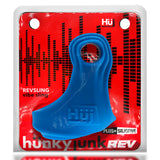 Oxballs Revsling Vibrating Cock Sling Teal Ice showcasing a vibrant blue design on a red background.