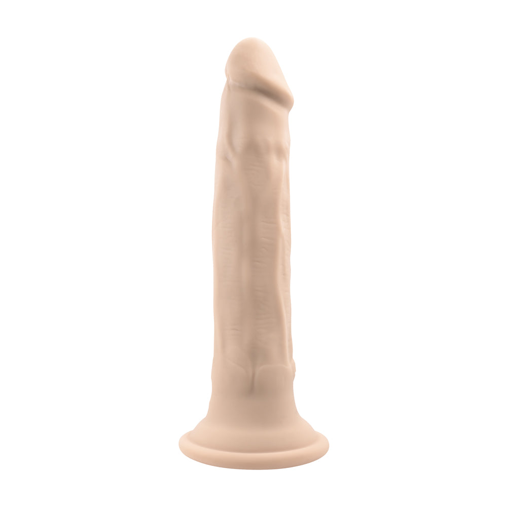 In Thrust We Trust Silicone Thrusting Dildo Vanilla with realistic texture and firm suction cup base.