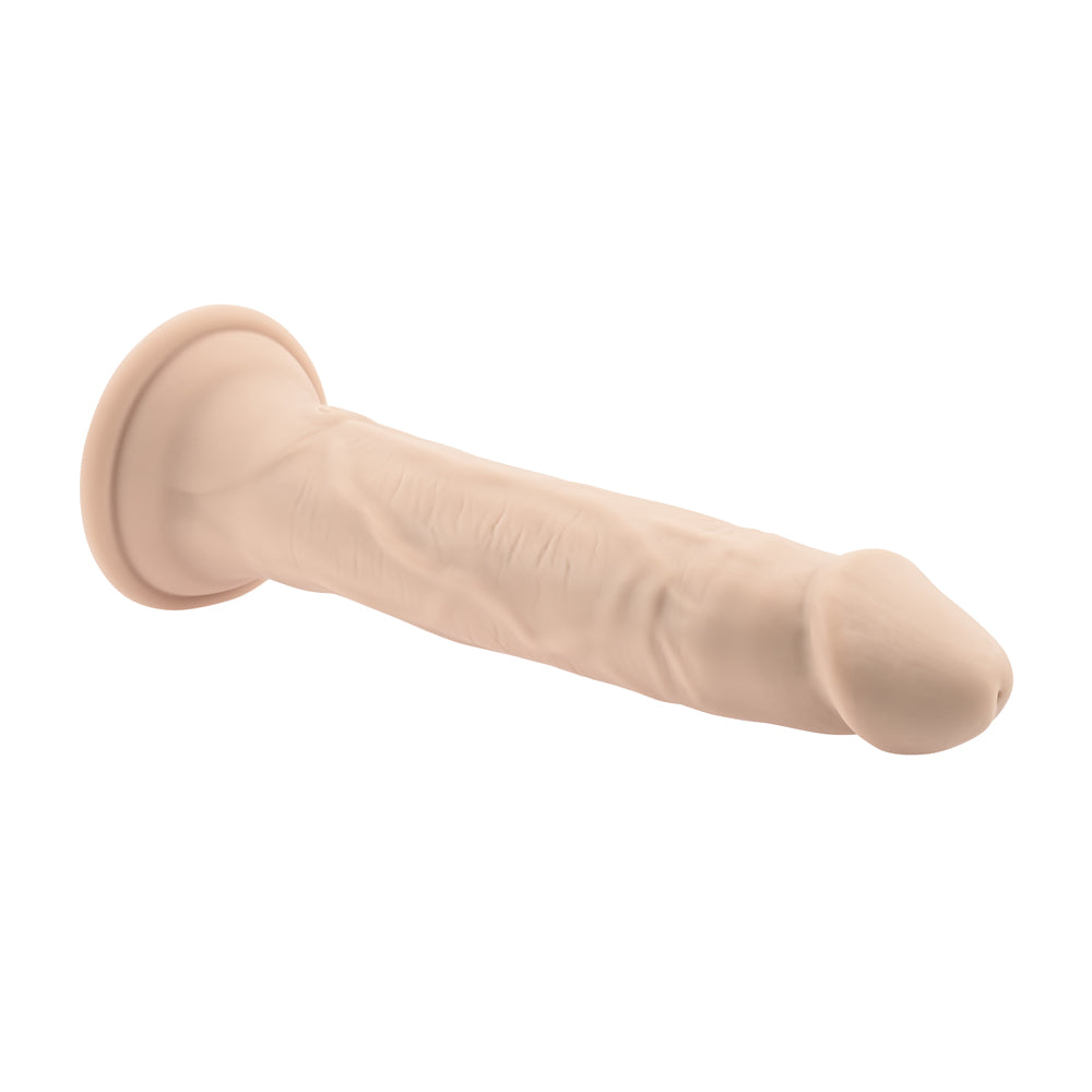 In Thrust We Trust Silicone Thrusting Dildo Vanilla features a lifelike design with a powerful suction cup base.