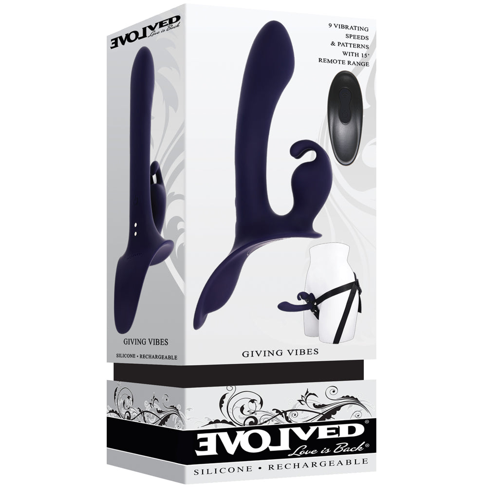 Giving Vibes Silicone Triple Stimulation Strap-On Purple packaging featuring a vibrant silicone design.