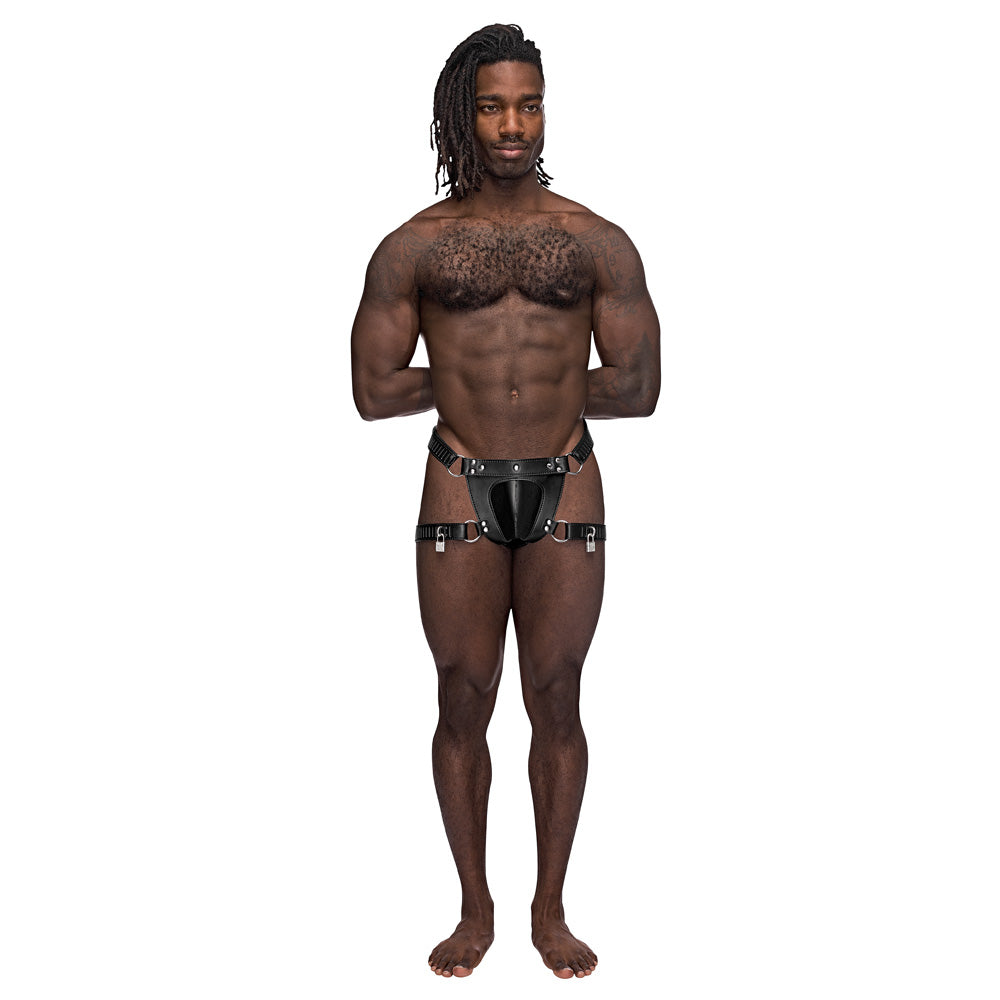 Male Power Scorpio Leather Chastity Thong Black displayed on a muscular model with a confident pose.