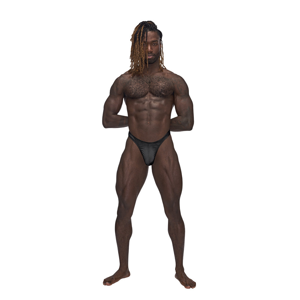 Male Power Barely There Bong Thong Black L/XL worn by a muscular model showcasing its sleek design.