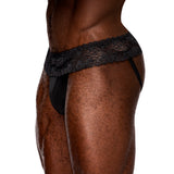 Male Power Sassy Lace Skirt Jock Black S M showcasing lace ruffled skirted waistband and sheer stretch mesh pouch.