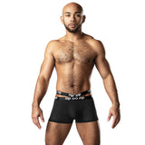 Infinite Comfort Amplifying Strappy Pouch Short Black Large on a male model showcasing body-hugging design and comfort.