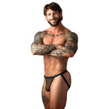 Male Power Fishnet 2.0 Jock Black S M worn by a muscular man with tattoos, showcasing a stylish and breathable design.