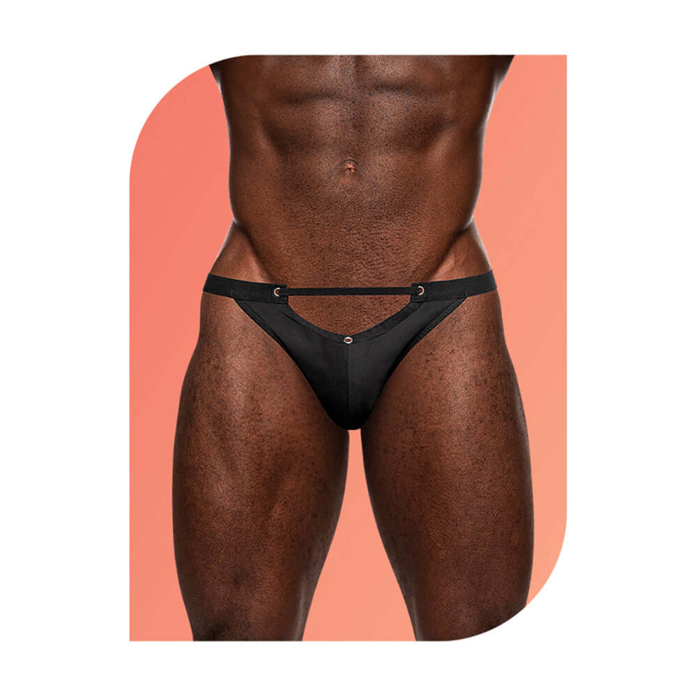 Male Power Wow Magnificence Micro V Black S M thong with cut out window and grommets, model wearing.
