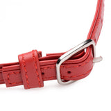 Close-up of the Master Series Slim Collar With O-ring Red showcasing its buckle and leather-like texture.