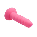 Rock Candy Suga Daddy 5.5 Inch Silicone Dildo Pink shown from the side, featuring a thick twisted shaft and realistic head.