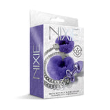 Nixie Metal Butt Plug & Furry Cuff Set Purple Metallic packaging featuring plush cuffs and jewel plug.