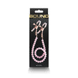 Bound Nipple Clamps Pink packaging featuring sleek design and adjustable clips for sensory play.