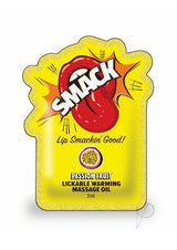 SMACK Warming Lickable Massage Oil Passion Fruit in a vibrant pouch with playful design and tropical flavor.