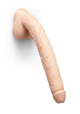 B-Vibe Bone Dildo with Balls & Suction Cup 17 inch Beige mounted on a wall, showcasing its lifelike detail.