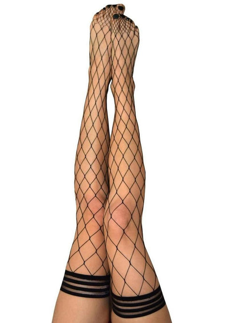Kixies Michelle Large Net Fishnet Thigh High Size B Medium Black showcased on legs, featuring a no-slip grip and stylish netting.