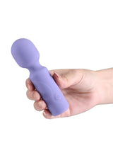 X and O's Adore Silicone Mini Vibrating Wand Blue held in a hand, showcasing its compact design.