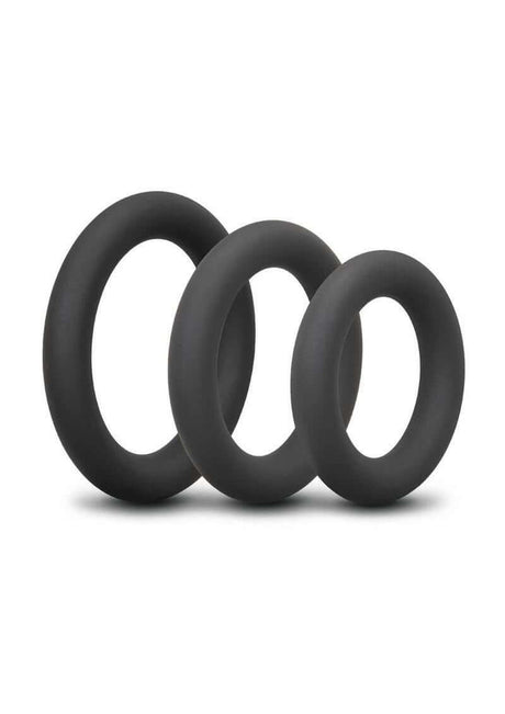 B-Vibe Snug Ring Thick Silicone Cock Ring 3 Pack Black featuring three durable silicone rings in various sizes.