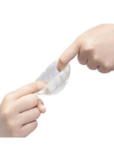 B-Vibe Stretch Tech Barrel Ultra Stretchy Cock Ring Clear being stretched by two hands, showcasing its flexibility and comfort.
