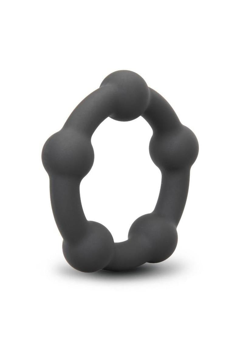 B-Vibe Snug Ring Orbit Nubby Silicone Cock Ring Black on a white background, showcasing its unique nubby design.