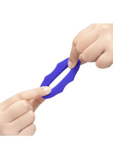 B-Vibe Flex Ring Hex Silicone Cock Ring Blue shown in hands demonstrating flexibility and durability.