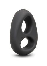 B-Vibe Flex Ring Eight Silicone Cock Ring Black displayed at an angle on a smooth surface.
