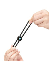 B-Vibe Lasso Grip Adjustable Silicone Cock Ring Black being held to showcase its flexible design and ergonomic grip.
