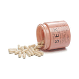 Bijoux Indiscrets Orgasm Glow Supplement 60 Capsules in a jar with spilled capsules.