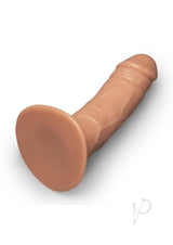 Together Realistic Dildo with Suction Base 6.5 Inch Caramel positioned on a white surface, showcasing its lifelike texture.