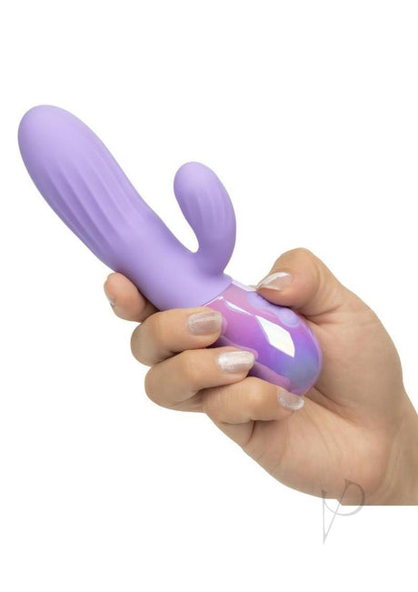 Aura Rotating Ripple Silicone Dual Massager Purple being held in hand, showcasing its sleek design and dual stimulation features.