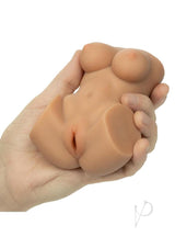 Cheap Thrills The Aerobics Instructor Stroker Pussy Caramel held in hand, showcasing its realistic design and texture.