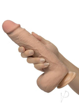 Working Stiff Shaft Slide Lumberjack Vibrating Dildo Vanilla held in hand, showcasing its realistic design and texture.