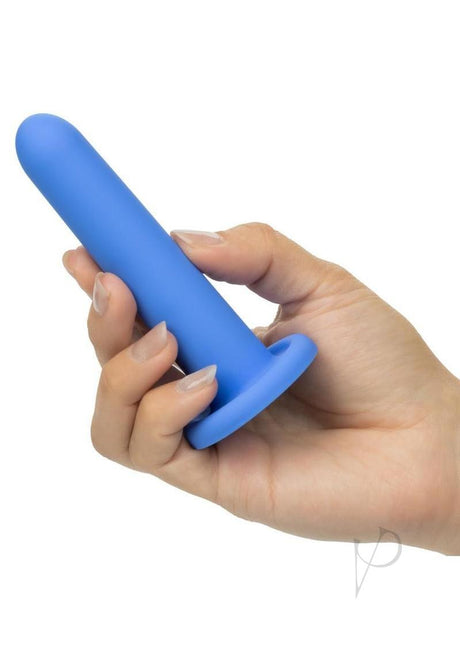Dilators Silicone Intermediate Set 4 Piece Assorted - blue silicone dilator held in hand for comfortable exploration.