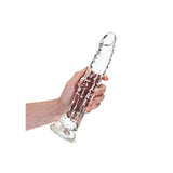 Realrock Crystal Clear Slim Dildo 10.5 inches held in hand, showcasing its clear, textured design for precision stimulation.