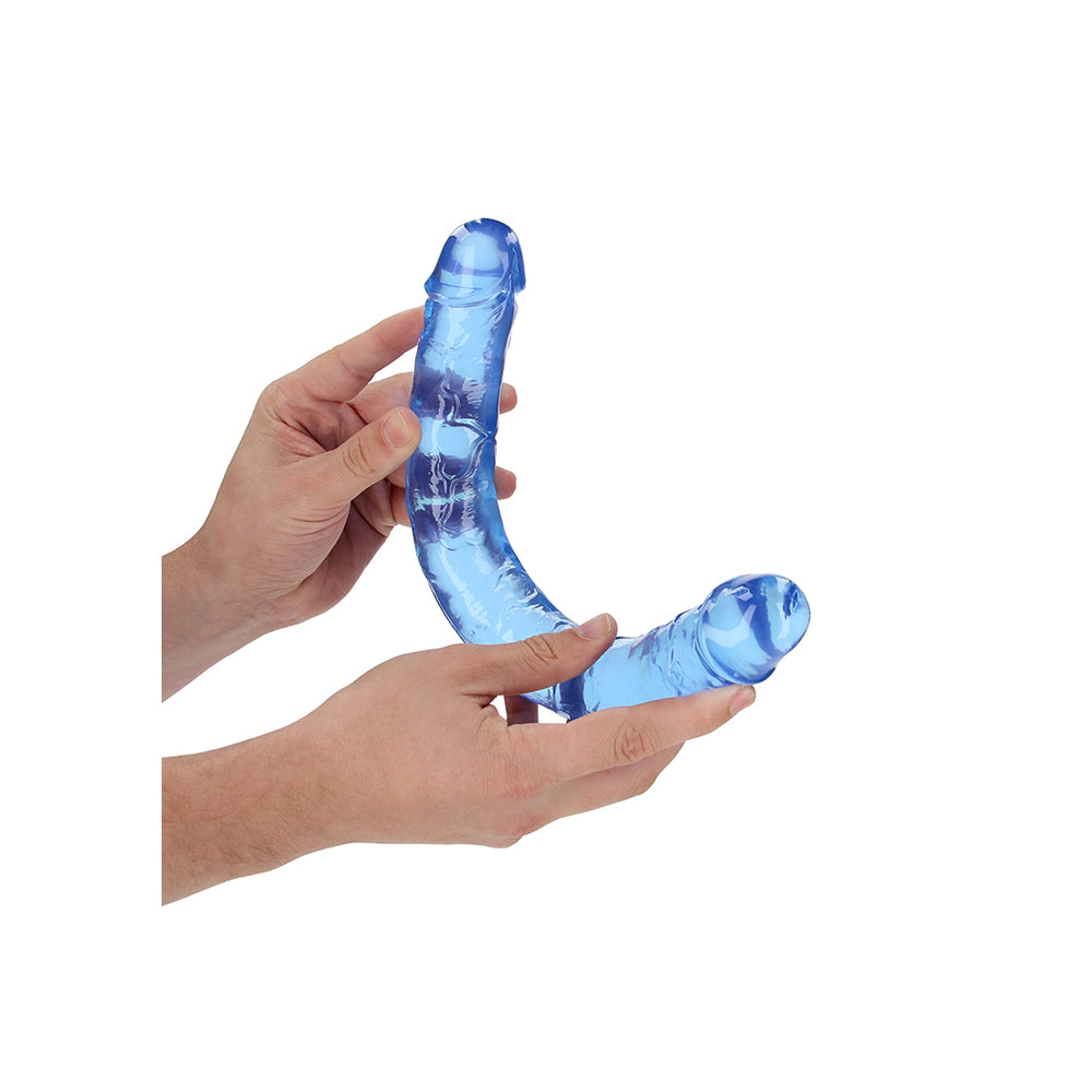 Realrock Crystal Clear Double Dong 13.4 inches Blue held in hands, showcasing its transparent design and dual ends.