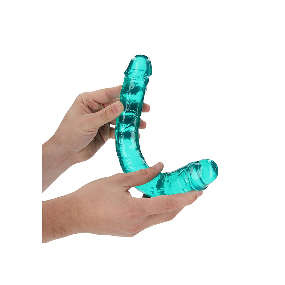 Realrock Crystal Clear Double Dong 13.4 inch Turquoise held in hands, showcasing its transparent turquoise design.