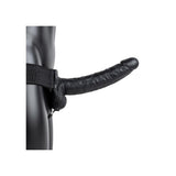 Realrock Hollow Strap-on With Balls 9 inch Black showing realistic design and strap-on harness on model.