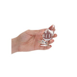 RealRock Crystal Clear Anal Plug 3.5 Inch Transparent held in hand for intimate play.