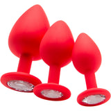 Ouch Regular Diamond Butt Plug Red in three sizes with smooth silicone and jewel-style base for anal play.