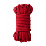 Ouch Japanese Rope 10 Meter Red coiled rope for Shibari-style play, designed for comfort and versatility in restraint.