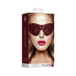Ouch Luxury Diamond Eye Mask Burgundy packaging featuring a model wearing a stylish red eye mask.