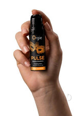 Orgie Liquid Pulse Arousal Intimate Gel 0.5 Oz Ice Caramel in a hand highlighting its sensory sensations.
