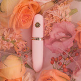 HighOnLove The Minis Pleasure Collection luxury intimacy product among pink roses and floral background