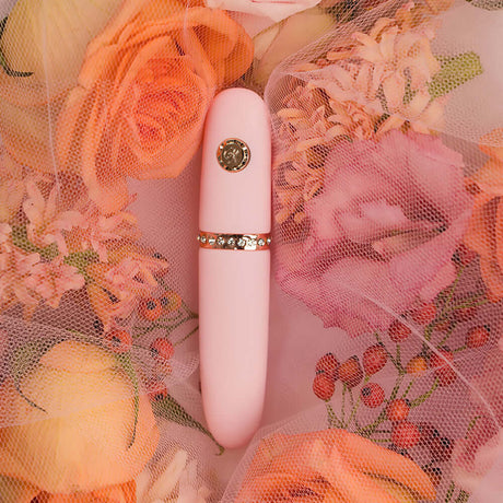 HighOnLove The Minis Pleasure Collection luxury intimacy product among pink roses and floral background