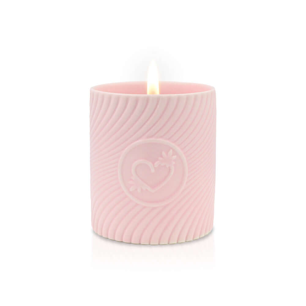 HighOnLove Pink Massage Candle Litchi Martini with a warm flame, designed for a luxurious massage experience.