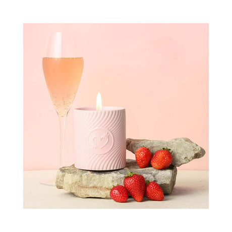 HighOnLove Pink Massage Candle Strawberries & Champagne with strawberries and sparkling champagne.