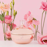 HighOnLove Canna Body Butter in an elegant jar surrounded by pink roses on a pastel background.