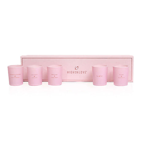 HighOnLove Mini Sensual Massage Candles Collection in elegant pink packaging with five unique candles.