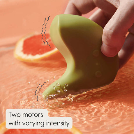 Ohnut Kiwi Vibrating Personal Massager in water, showcasing its ergonomic design and two motors with varying intensity.