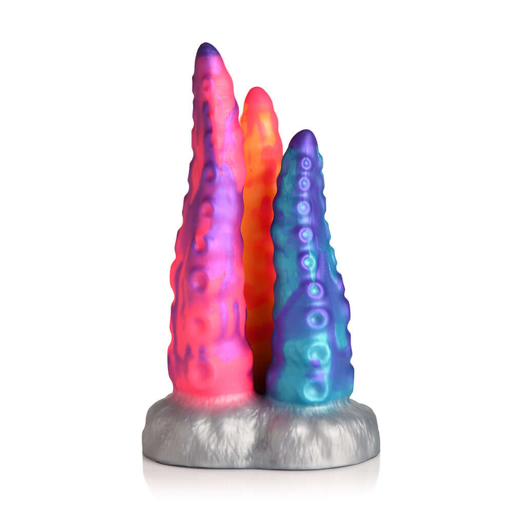 Creature Cocks Tentacle Trio Silicone Dildo featuring three vibrant tentacles in orange, pink, and blue.