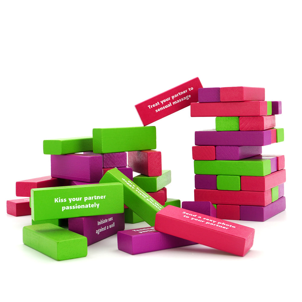 Play Wiv Me Tower of Pleasure Adult Game featuring colorful blocks with seductive prompts.